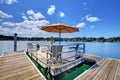 Lake with wood pier and private party raft. Royalty Free Stock Photo