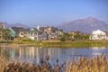 Lakefront homes along Oquirrh Lake on a sunny day Royalty Free Stock Photo