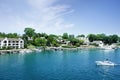 Lakefront homes and boats in the Round Lake in downtown Charlevoix Michigan Royalty Free Stock Photo