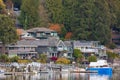 Lakefront residences. Houses on the shore of Indian Arm North Vancouver BC. Peaceful Houses and boats on the Bay