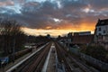 Laken, Brussels Capital Region - Belgium - Colorful clouds over the railway tracks at the local metro and train stop Pannenhuis -