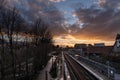 Laken, Brussels Capital Region - Belgium - Colorful clouds over the railway tracks at the local metro and train stop Pannenhuis - Royalty Free Stock Photo