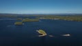 Lakeshore with islands at Lake Siljan from above with blue sky in Dalarna, Sweden Royalty Free Stock Photo