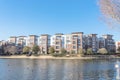 Lakeside apartment building complex with blue sky in America