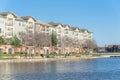 Lakeside apartment building complex with blue sky in America