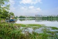 Lakeside boats with modern city in background on sunny summer da Royalty Free Stock Photo