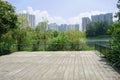 Lakeside fenced viewing platform in city of sunny summer