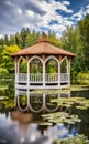 Lakeside gazebo surrounded by water lilies.