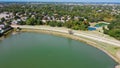 Aerial view waterfront houses near highway with lush green trees in Flower Mound, Texas, USA Royalty Free Stock Photo