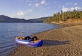 Lakeside with inflatable kayak Royalty Free Stock Photo