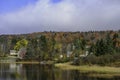 Idyllic lakeside living amidst fall foliage in New England