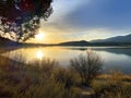 Lakeside morning sunrise sunny reflection mountain lake shore hiking trail adventure