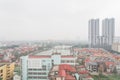 Lakeside neighborhood near downtown Hanoi, Vietnam under polluted air
