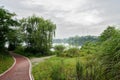 Lakeside path and trail in cloudy summer morning