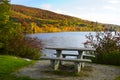 Lakeside picnic table in New England in Autumn