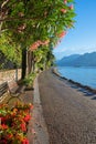 Lakeside promenade with bench, beautiful garda lake Royalty Free Stock Photo