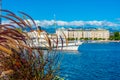 Lakeside promenade of the swiss city Geneva viewed behind a flow