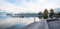 Lakeside promenade with view to water castle, called Schloss Orth, at Traunsee lake, Salzkammergut
