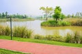 Lakeside red path in sunny spring Royalty Free Stock Photo