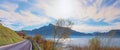 Lakeside road along lake Mondsee with mountain view and autumnal trees