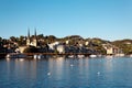 Lakeside scenery of Lucerne on a sunny summer day with majestic church towers amid beautiful waterfront buildings Royalty Free Stock Photo