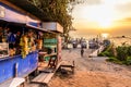 Lakeside stores, boats, jetties & volcano in golden hour, Lake Atitlan, Guatemala Royalty Free Stock Photo