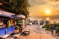 Lakeside stores, boats, jetties & volcano in golden hour, Lake Atitlan, Guatemala Royalty Free Stock Photo