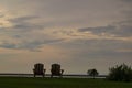 Lakeside sunset landscape with Adirondack chairs Royalty Free Stock Photo