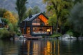 Lakeside Tranquility: Beautiful Cozy House with Expansive Windows Royalty Free Stock Photo