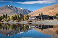 lakeside view, with reflection of towering mountains in the background