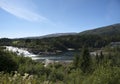 Laksforsen waterfall surounded by forest, Nordland Royalty Free Stock Photo