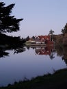 the lakside house in the naturel park in the evening Royalty Free Stock Photo