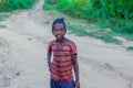 Poor Ethiopian Children smiling on the rural road