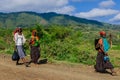 Poor Ethiopian People smiling on the rural road