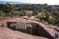 Lalibela, Ethiopia - Feb 13, 2020: Ethiopian people at the famous Rock-Hewn Church of Saint George - Bete Giyorgis Royalty Free Stock Photo