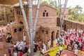 LALIBELA, ETHIOPIA - MARCH 29, 2019: Christian priests, devotees and tourists around Bet Maryam, rock-cut church in