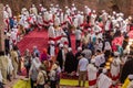 LALIBELA, ETHIOPIA - MARCH 29, 2019: Christian priests, devotees and tourists in front of Bet Maryam, rock-cut church in