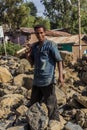 LALIBELA, ETHIOPIA - MARCH 29, 2019: Local worker breaking rocks on a road construction in Lalibela village, Ethiop