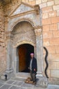 Lalish is an important holy site of the Yazidis, located in Iraqi Kurdistan. An unknown man guards the entrance to the shrine with