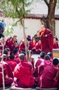 Lama debating Buddhist scriptures Royalty Free Stock Photo