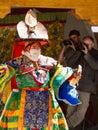 Lama performs a religious masked and costumed mystery black hat dance of Tibetan Buddhism