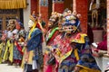 Buddhist lamas dressed in mystical mask dancing Tsam mystery dance in time of Yuru Kabgyat Buddhist festival at Lamayuru Gompa, La Royalty Free Stock Photo