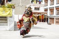 LAMAYURU, INDIA - SETEMBER 13, 2015: An unidentified buddhist lamas dressed in mystical mask dancing Tsam mystery dance in time of Royalty Free Stock Photo