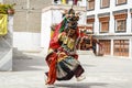 LAMAYURU, INDIA - SETEMBER 13, 2015: An unidentified buddhist lamas dressed in mystical mask dancing Tsam mystery dance in time of Royalty Free Stock Photo