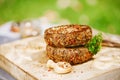 Lamb burgers spiced by mint and lamb rub on wood board