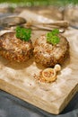 Lamb burgers spiced by mint and lamb rub on wood board