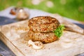 Lamb burgers spiced by mint and lamb rub on wood board