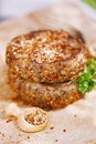 Lamb burgers spiced by mint and lamb rub on wood board