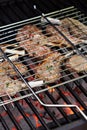Lamb chops in grilling basket on grill Royalty Free Stock Photo