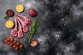 Lamb chops or mutton cuts, on black dark stone table background, top view flat lay, with copy space for text Royalty Free Stock Photo